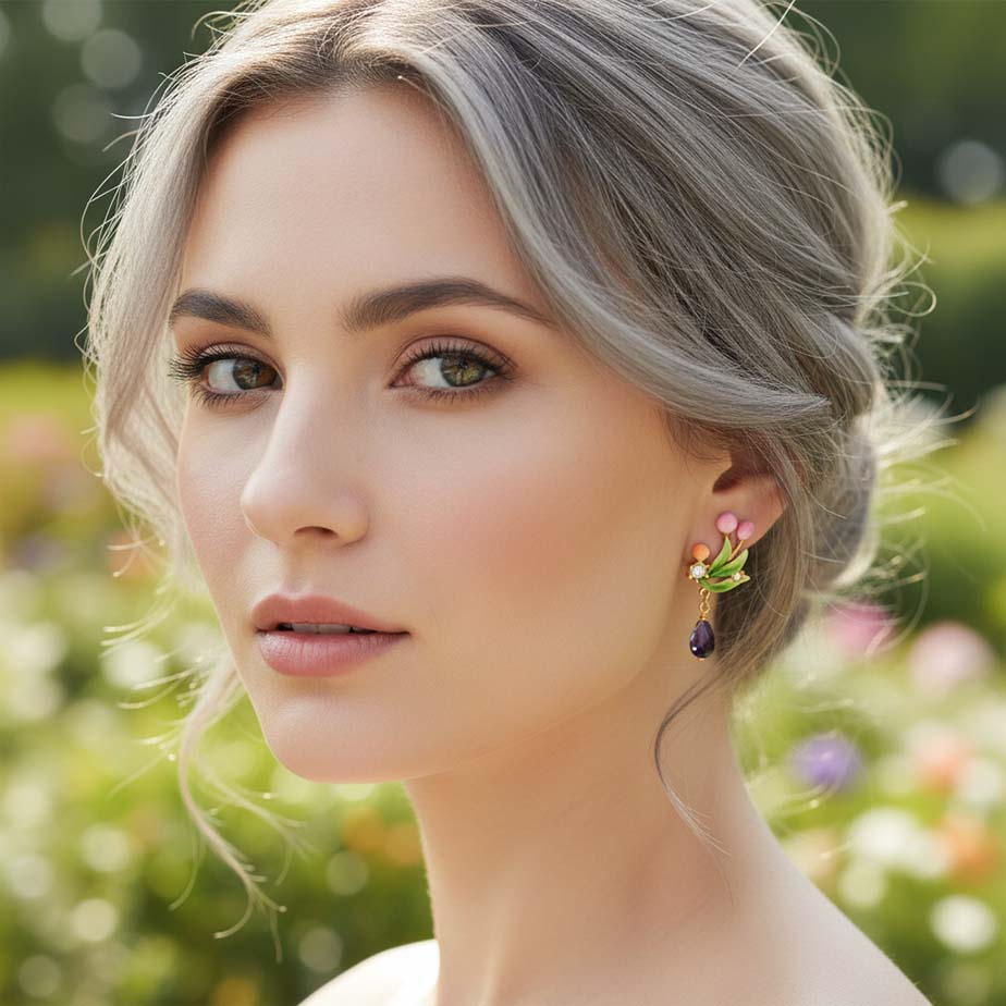 Woman wearing floral earrings with a blurred natural background