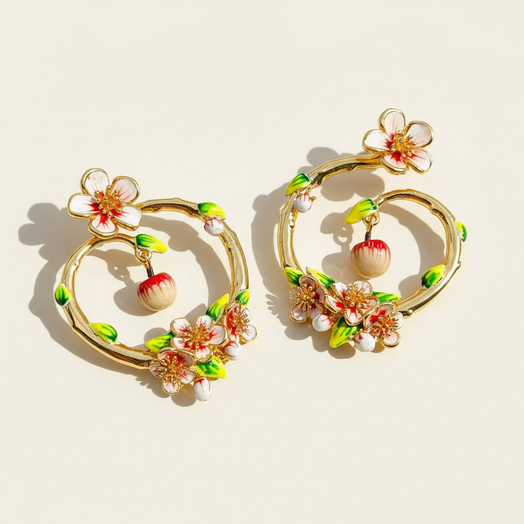 Decorative earrings with floral designs on a beige background