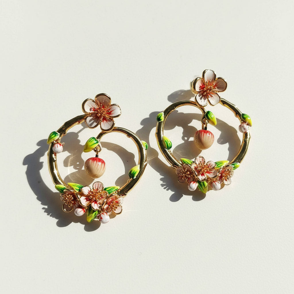 Pair of floral hoop earrings on a light background