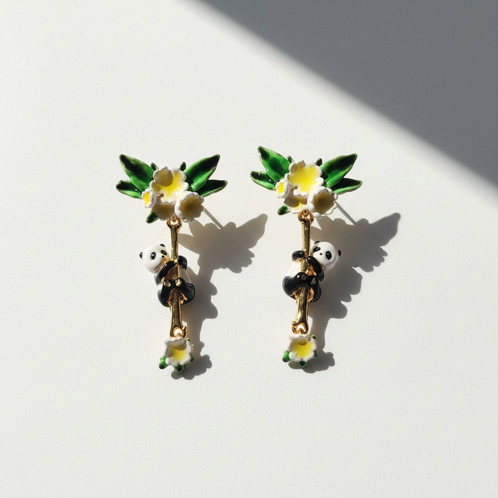 Panda and flower earrings on a white background