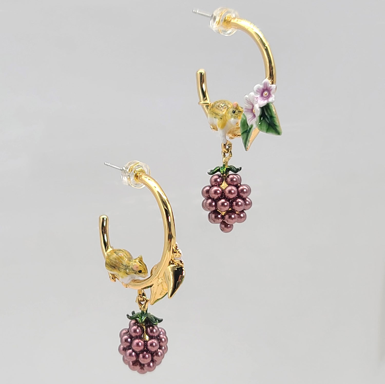 Gold hoop earrings with handpainted enamel mouse, lilac flowers, and purple berry charm