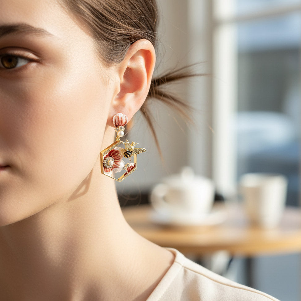 Close-up of a woman wearing a floral earring with a blurred indoor background