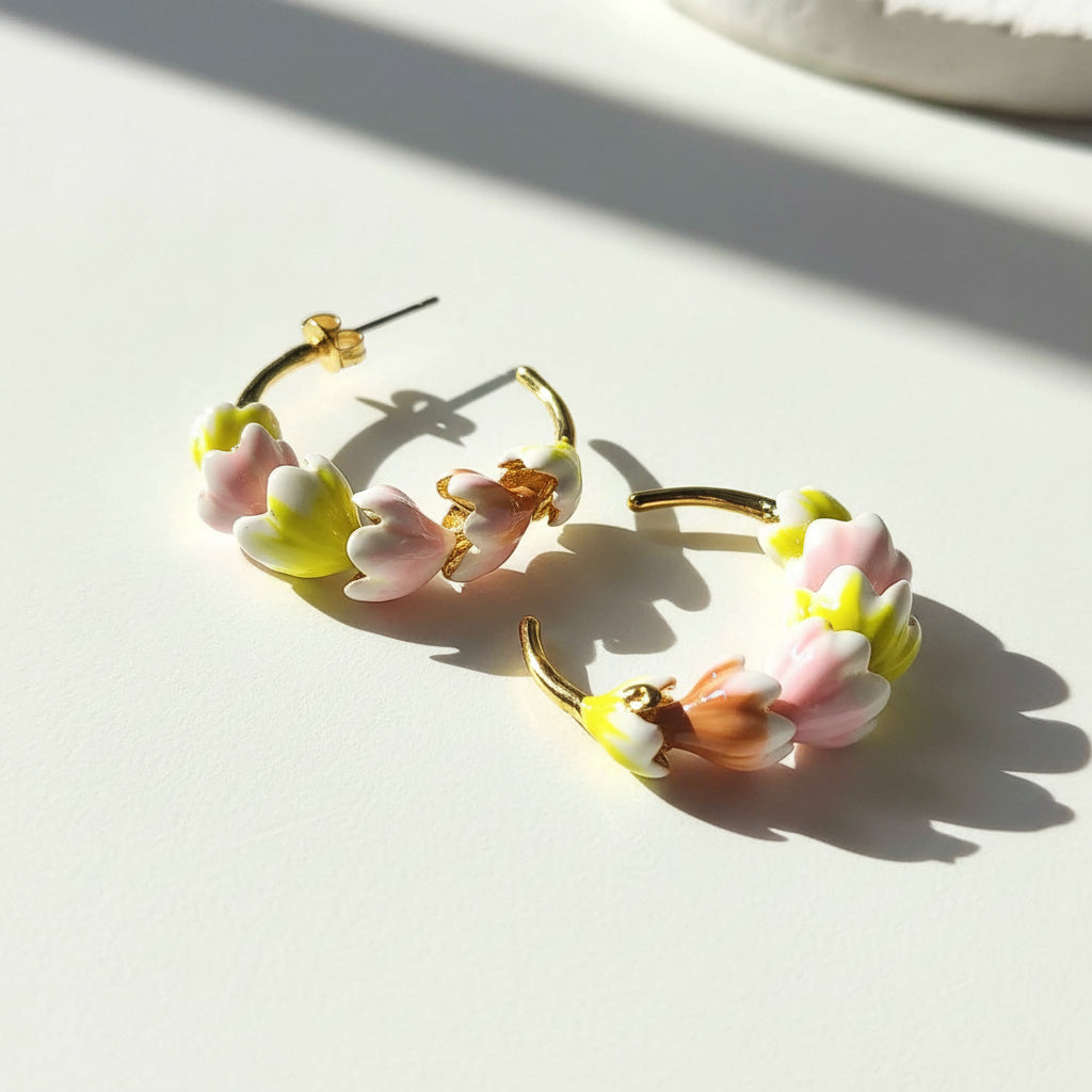 Floral hoop earrings on a light surface