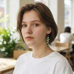 Woman wearing earrings in a casual indoor setting