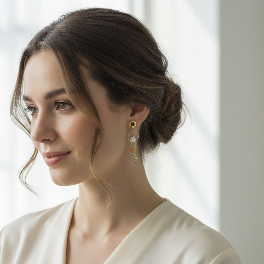 Woman wearing elegant earrings with a neutral background