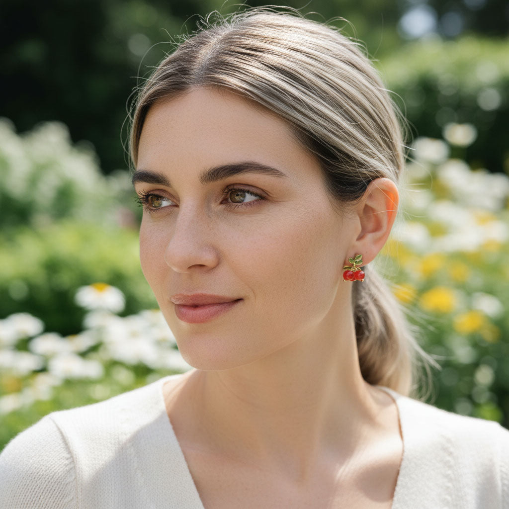 Woman wearing colorful earrings in a garden setting
