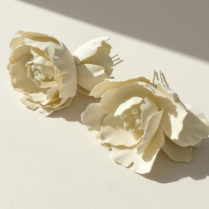 Close-up of layered magnolia petals with pearl details.