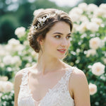Bride wearing handcrafted porcelain floral hair vine in soft updo, garden setting.