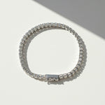 Top-down sunlight shot of platinum moissanite tennis bracelet
