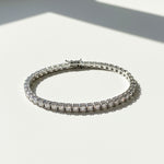 Full view of 3mm moissanite tennis bracelet on white background