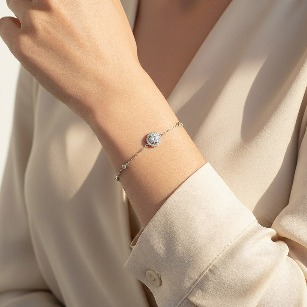 1ct D/VVS1 moissanite halo bracelet worn on wrist in platinum plated sterling silver