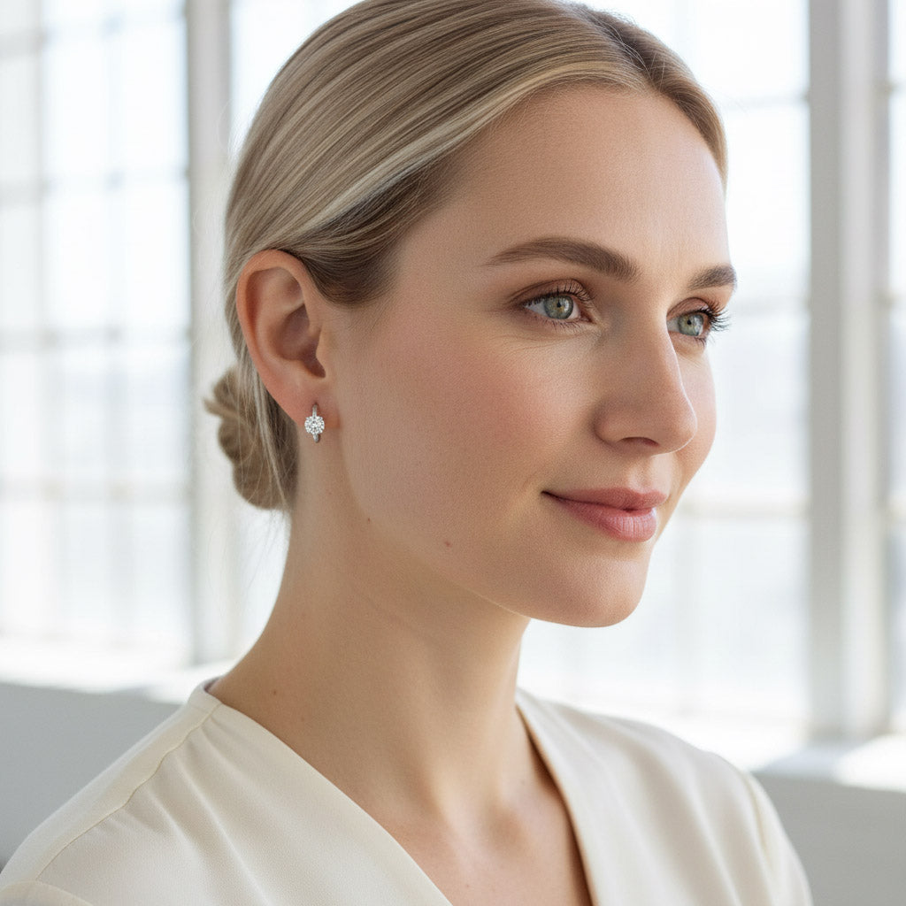 Model wearing platinum-plated sterling silver hoop earrings with round diamond stones