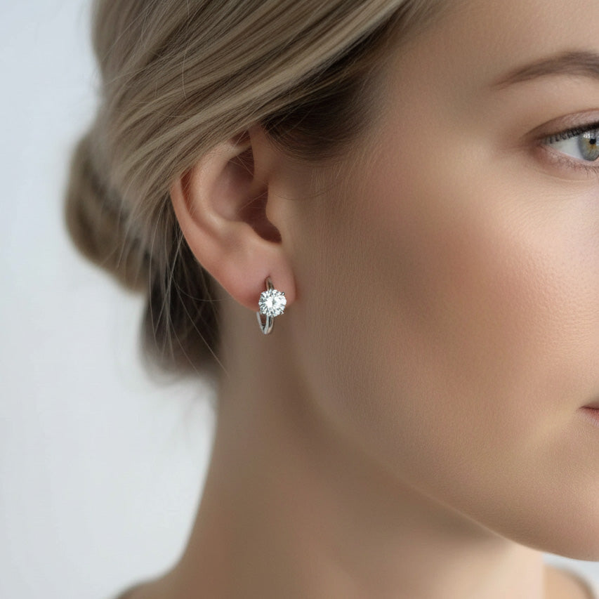 Side view of woman wearing 1.0ct lab-grown diamond hoop earrings in sterling silver