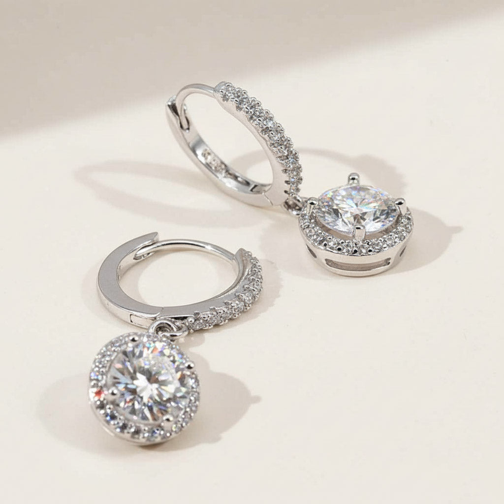 Side view of halo lab-grown diamond drop earrings with silver hoops