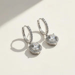 Sparkling halo drop earrings with round-cut moissanite diamonds in silver setting