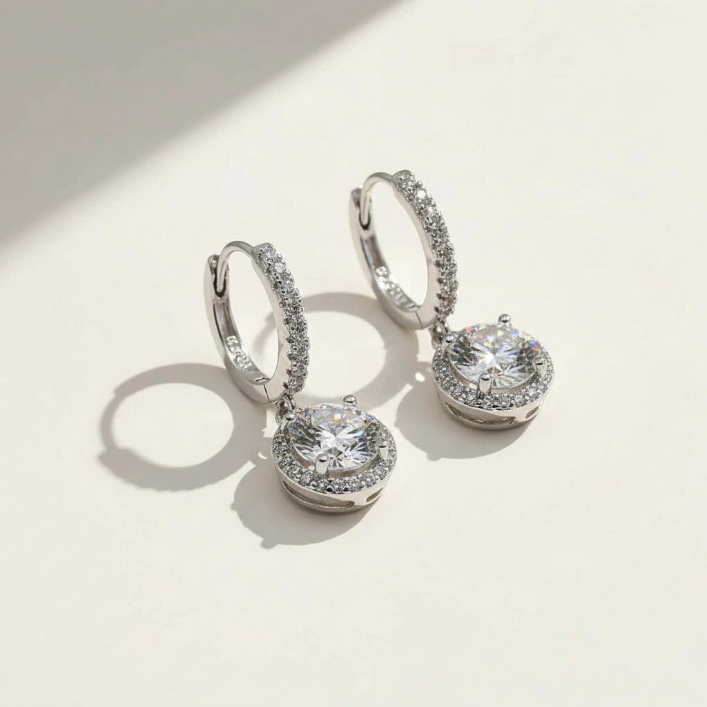 Sparkling halo drop earrings with round-cut moissanite diamonds in silver setting