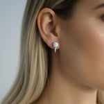 Model wearing sterling silver lab-grown diamond hoop earrings, 2ct total