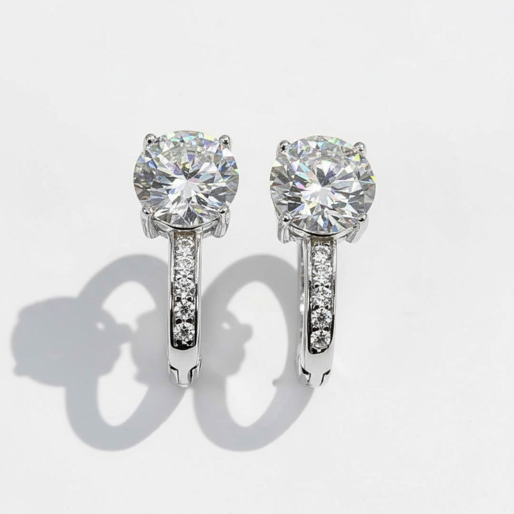 Front view of round-cut lab-grown diamond earrings in sterling silver hoops