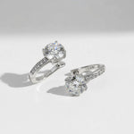 Pair of sterling silver moissanite hoop earrings with D/VVS1 lab-grown diamonds