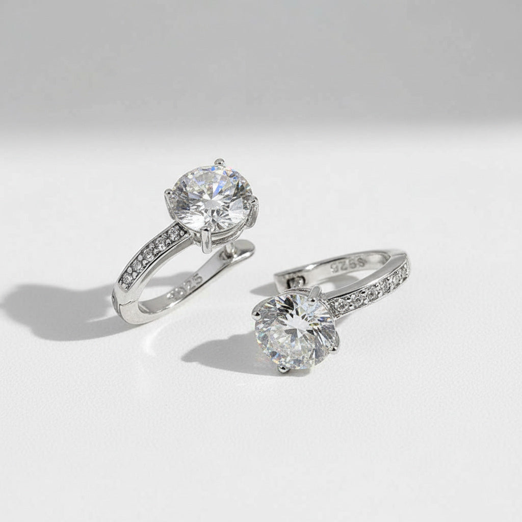 Pair of sterling silver moissanite hoop earrings with D/VVS1 lab-grown diamonds