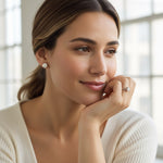 Model wearing sterling silver 2ct diamond stud earrings, elegant everyday style