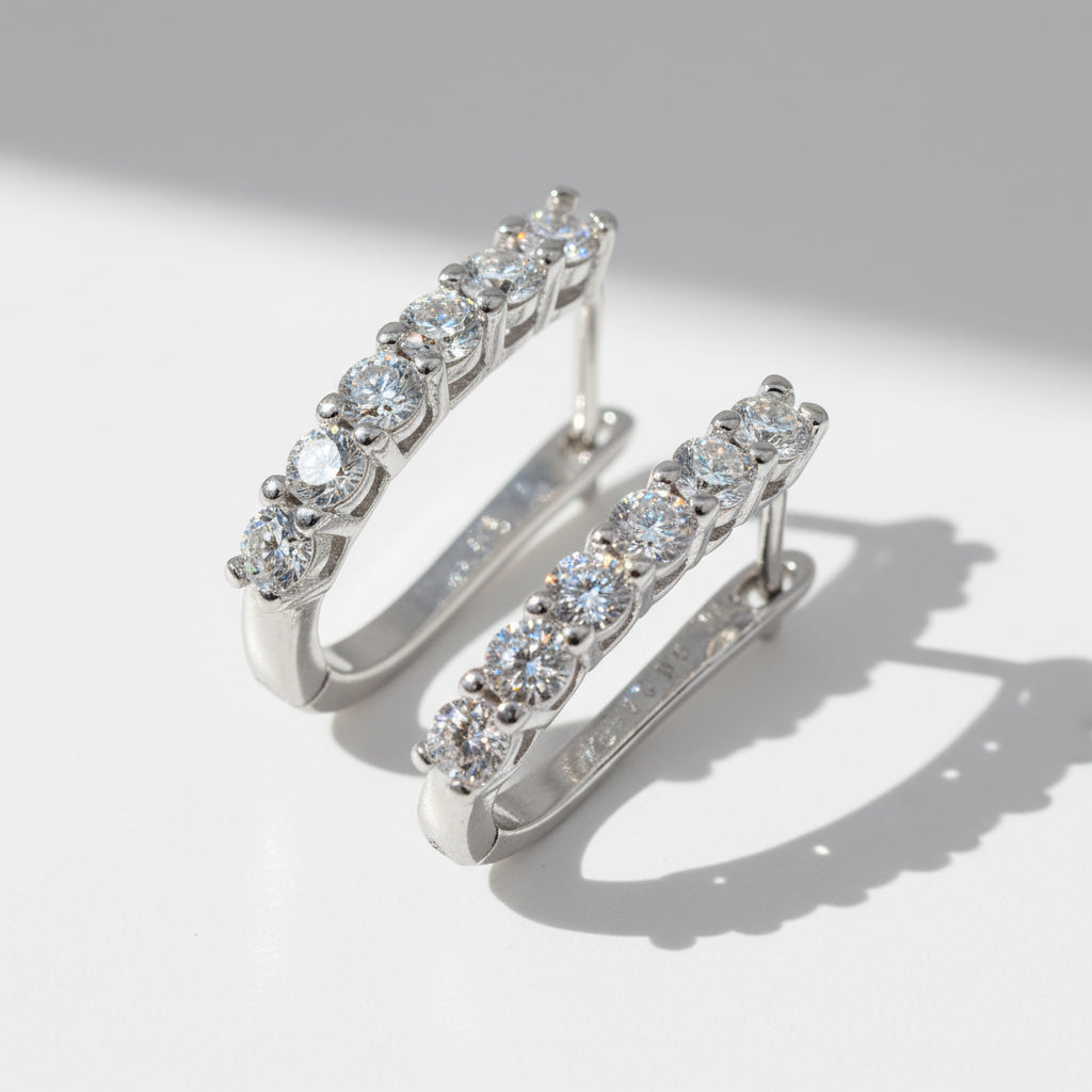 Close-up of sterling silver hoops featuring 1.2ct+1.2ct D/VVS1 lab-grown diamonds