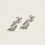 Round lab-grown diamond stud earrings with silver butterfly backs for pierced ears