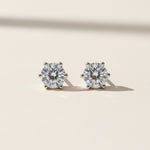 Close-up of 1ct moissanite diamond studs in polished sterling silver setting