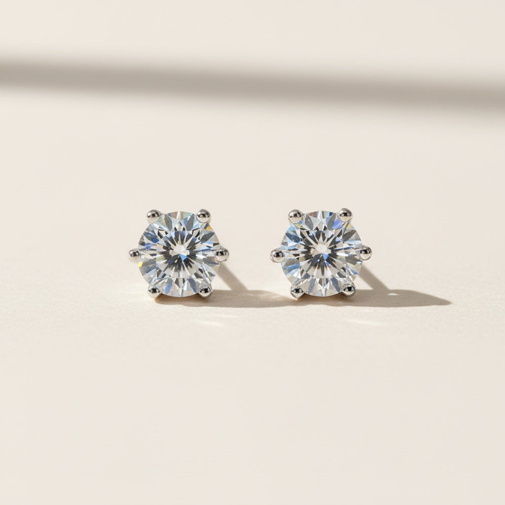 Close-up of 1ct moissanite diamond studs in polished sterling silver setting