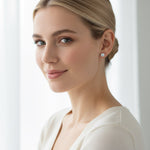 Model wearing sterling silver lab-grown diamond stud earrings, minimalist style