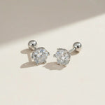 Platinum-plated sterling silver moissanite stud earrings, classic round-cut design for everyday elegance