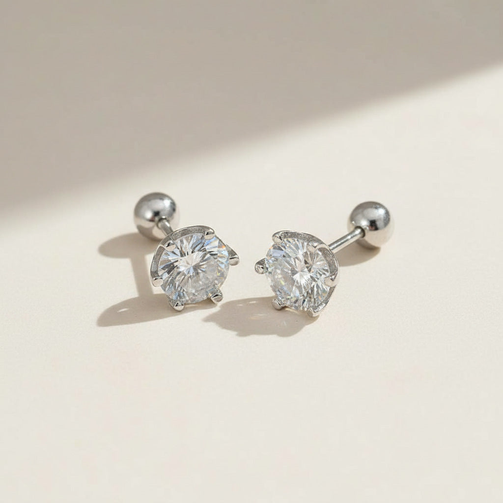 Platinum-plated sterling silver moissanite stud earrings, classic round-cut design for everyday elegance