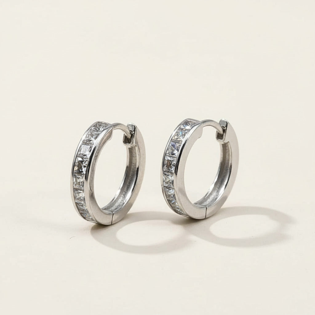 Pair of platinum-plated silver hoop earrings with channel-set princess-cut CZ stones