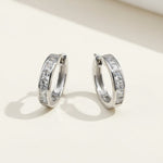 Elegant sterling silver CZ hoop earrings with platinum plating and geometric channel setting