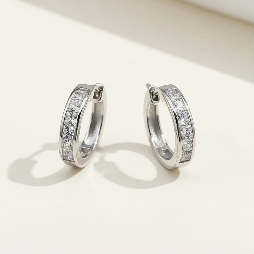 Elegant sterling silver CZ hoop earrings with platinum plating and geometric channel setting