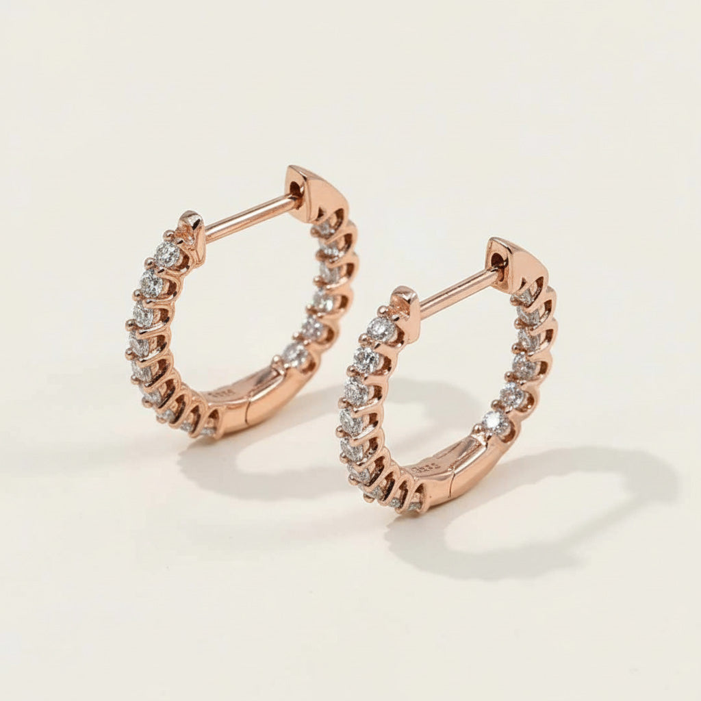 Rose gold-plated sterling silver hoop earrings featuring lab-grown moissanite stones in a full circle claw setting.