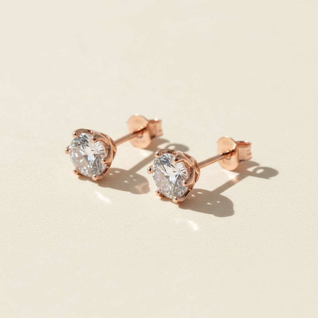 Rose gold-plated S925 stud earrings with 2ct total lab-grown Portuguese-cut diamonds by A2K London.