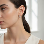Model wearing inside-out lab grown moissanite hoop earrings in platinum S925