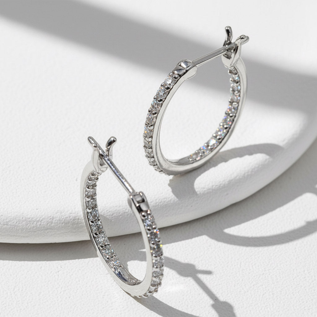 Sparkling D/VVS1 moissanite inside-out hoop earrings showing full pavé detail.