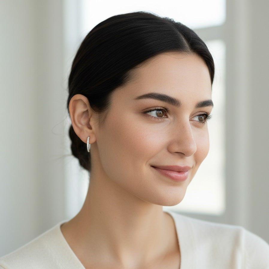 Model wearing 23mm inside-out moissanite hoop earrings in platinum S925