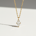 Gold-plated marquise 1ct D/VVS1 moissanite necklace on a clean sunlight background
