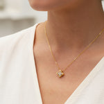 Model wearing gold-plated moissanite clover necklace with 3mm stones