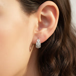 Model wearing sterling silver leaf moissanite hoop earrings