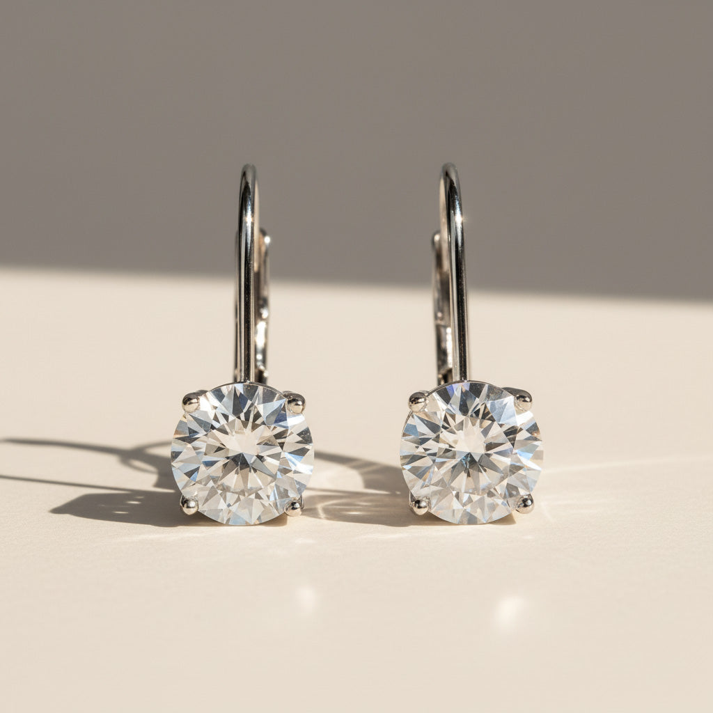Front view of round brilliant 1ct moissanite lever-back earrings in silver.