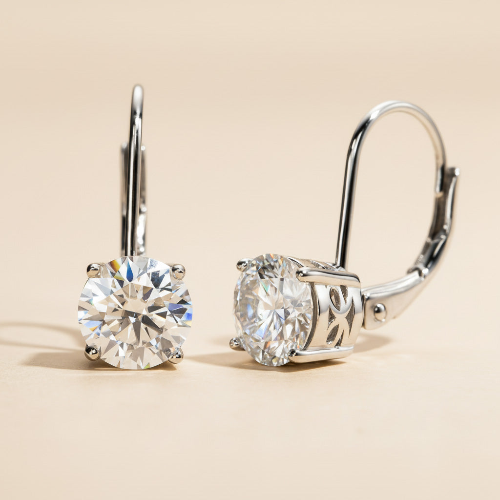 Pair of diamond earrings on a beige background