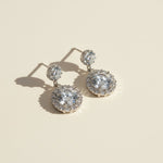 Moissanite halo drop earrings in platinum plated sterling silver, 2.0ct total