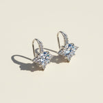 Star moissanite stud earrings in silver with round cut lab grown diamond stones