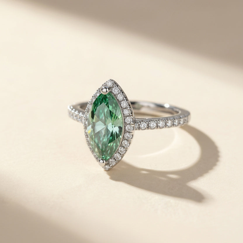 side view green marquise moissanite ring with diamond halo pavé band