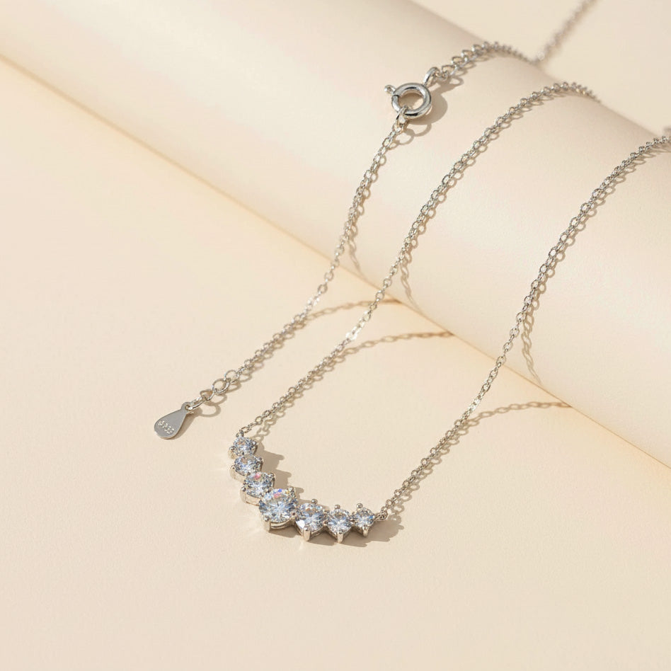 Sterling silver moissanite bar necklace with adjustable chain and secure clasp closure