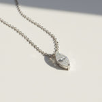 Side angle of 0.1ct marquise moissanite pendant on sterling silver chain.